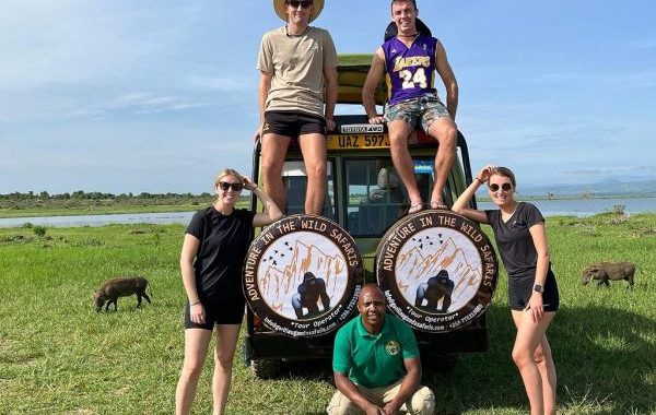 Adventure In The Wild Safaris Vehicle On A Wildlife Tour In Uganda.