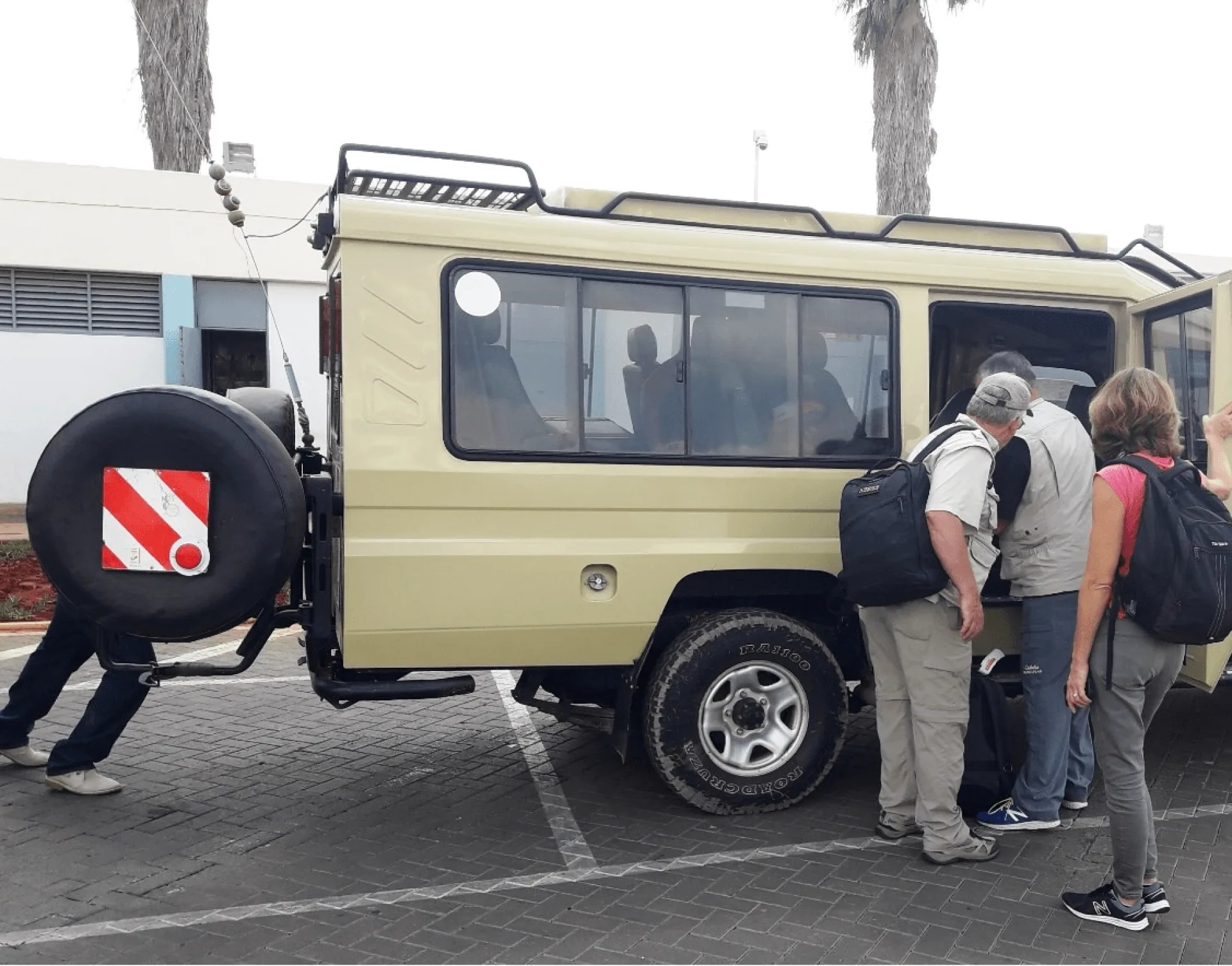 Do safari operators arrange airport transfers?